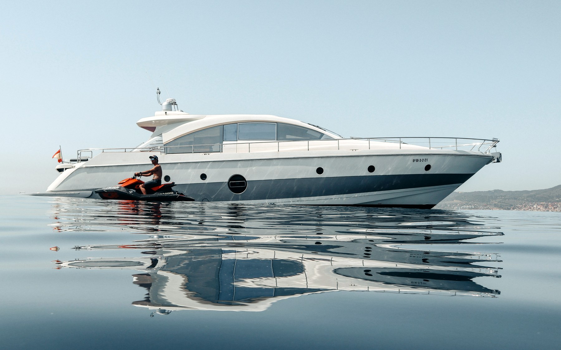 Aicon 72 SL Gadea yacht charter in Mallorca — cruising the south-west coast of Mallorca on a sunlit afternoon, from Marina Palma, La Lonja.