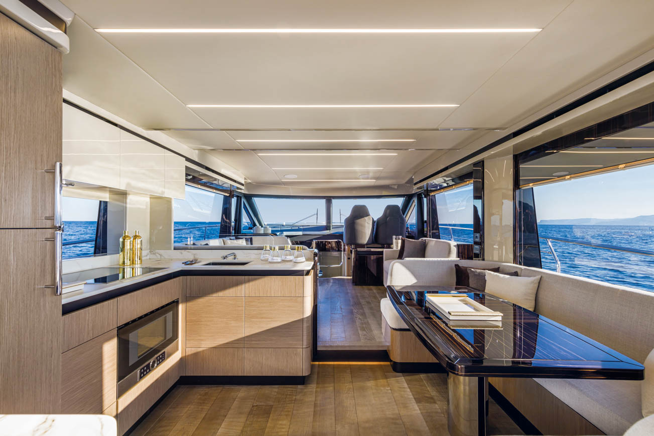 Absolute 62 Fly Emilia II yacht charter in Mallorca — cockpit lounge shaded for long Mediterranean lunches, from Marina Port de Mallorca, Palma.