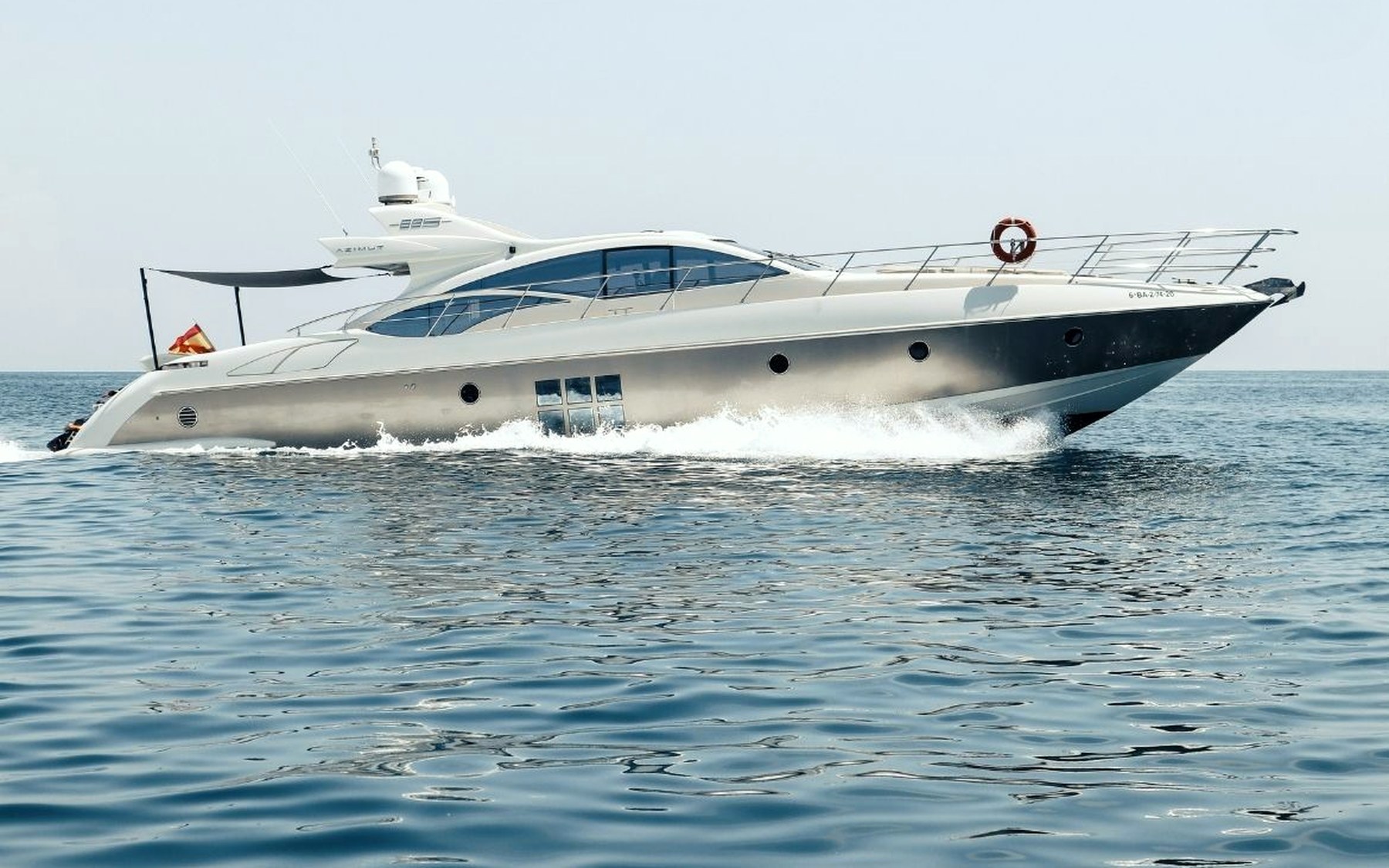 Azimut 68 S Esperanza yacht charter in Mallorca — cruising the south-west coast of Mallorca on a sunlit afternoon, from Marina Palma, La Lonja.