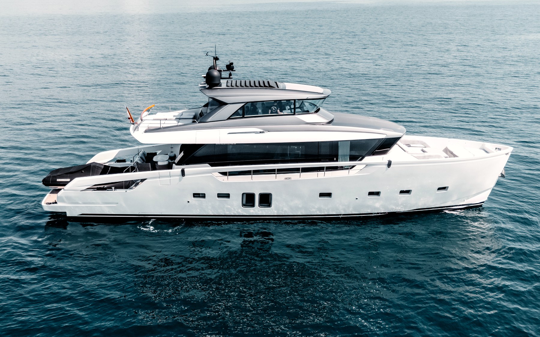 San Lorenzo SX76 Globito de Mar yacht charter in Mallorca — cruising the south-west coast of Mallorca on a sunlit afternoon, from Marina Port, Palma de Mallorca.