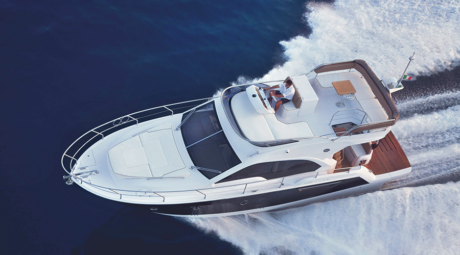 Sessa 40 Fly Zantastic yacht charter in Mallorca — anchored in a turquoise cove near Puerto Portals, from Club Nàutic Porto Cristo.