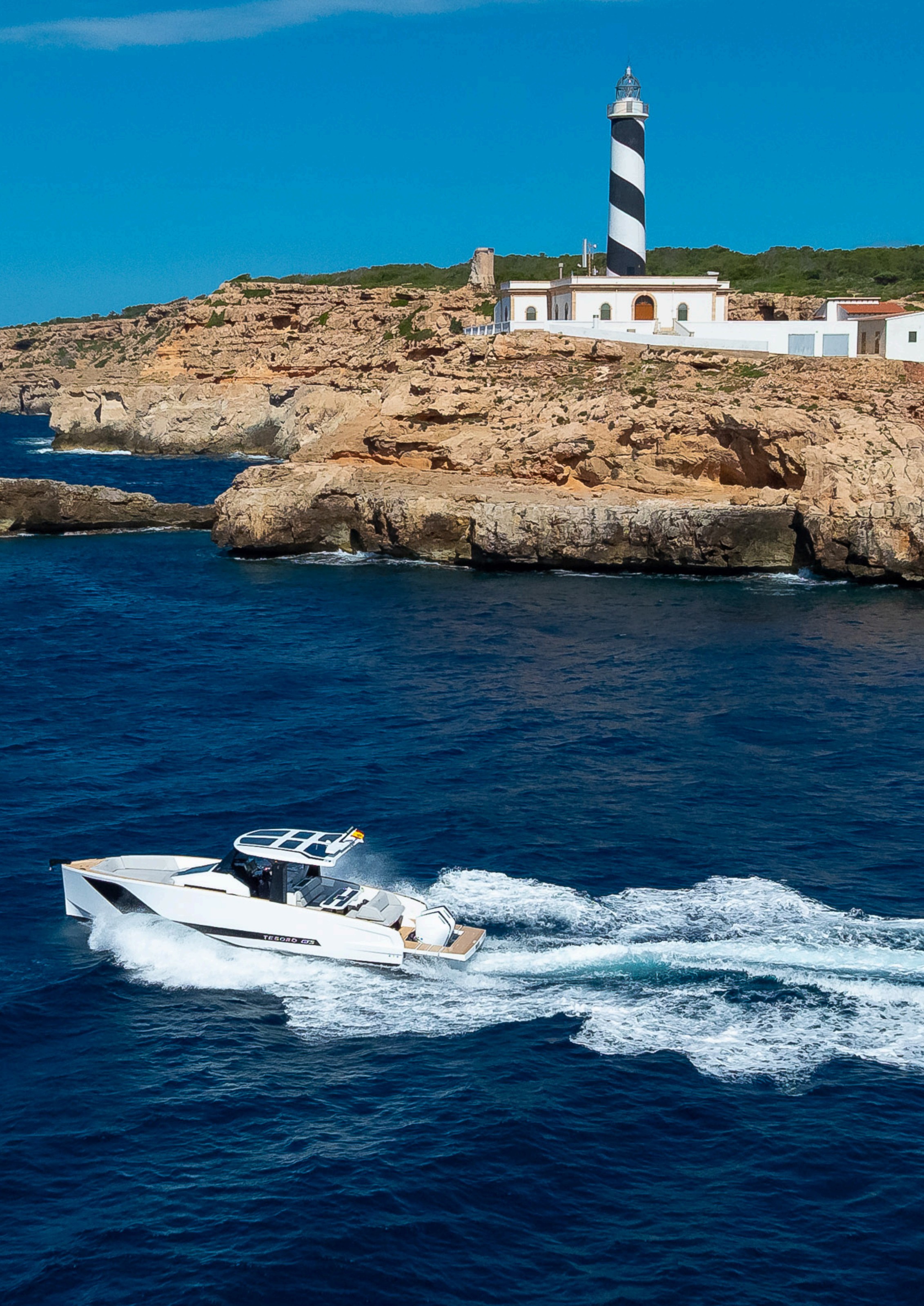 Tesoro T40 GTS New 2026 yacht charter in Mallorca — cruising the south-west coast of Mallorca on a sunlit afternoon, from Puerto Portals.