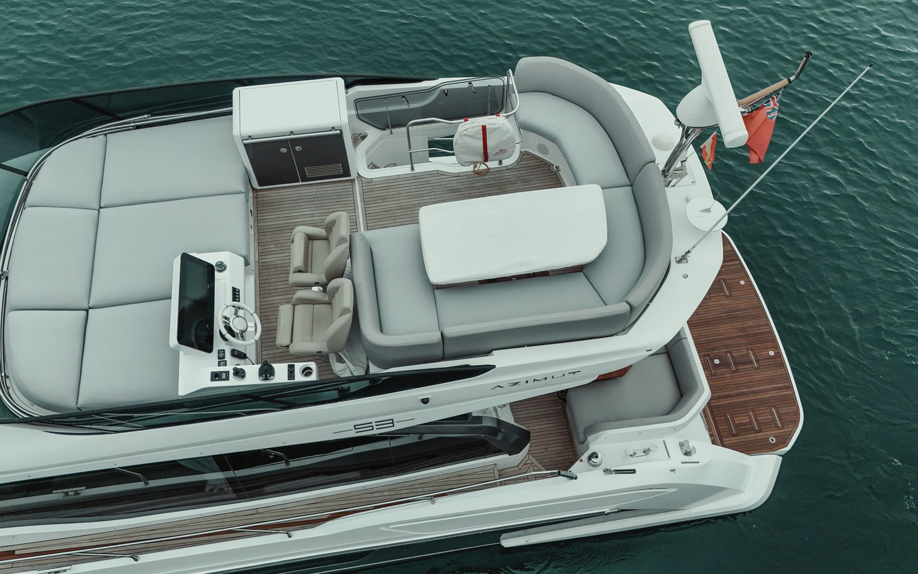 Azimut 53 Sea Shell yacht charter in Mallorca — cockpit lounge shaded for long Mediterranean lunches, from Marina Palma, La Lonja.