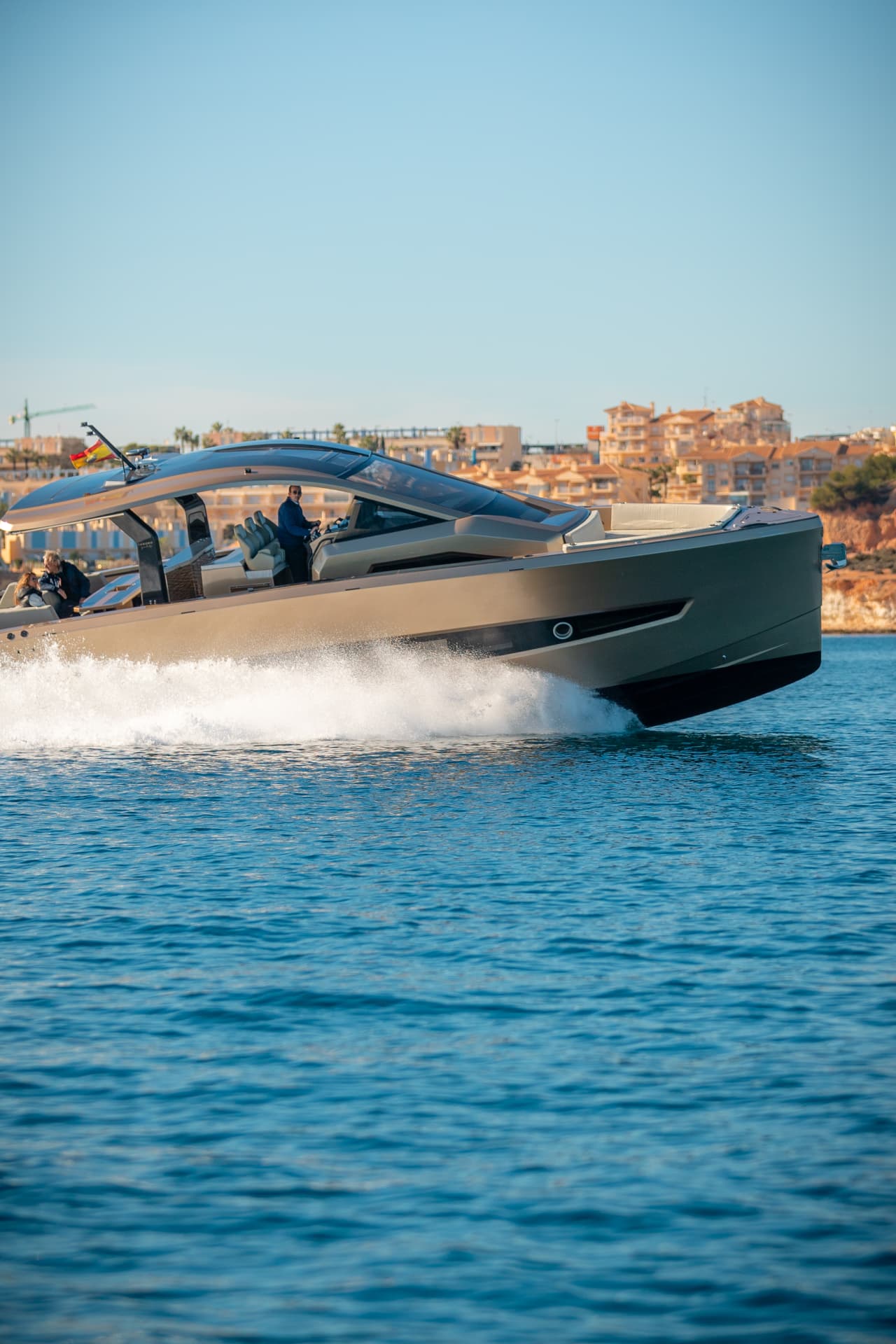 Tesoro T50 Speciale Goldfinger · Armani/Casa yacht charter in Mallorca — cruising the south-west coast of Mallorca on a sunlit afternoon, from Club de Mar, Palma.
