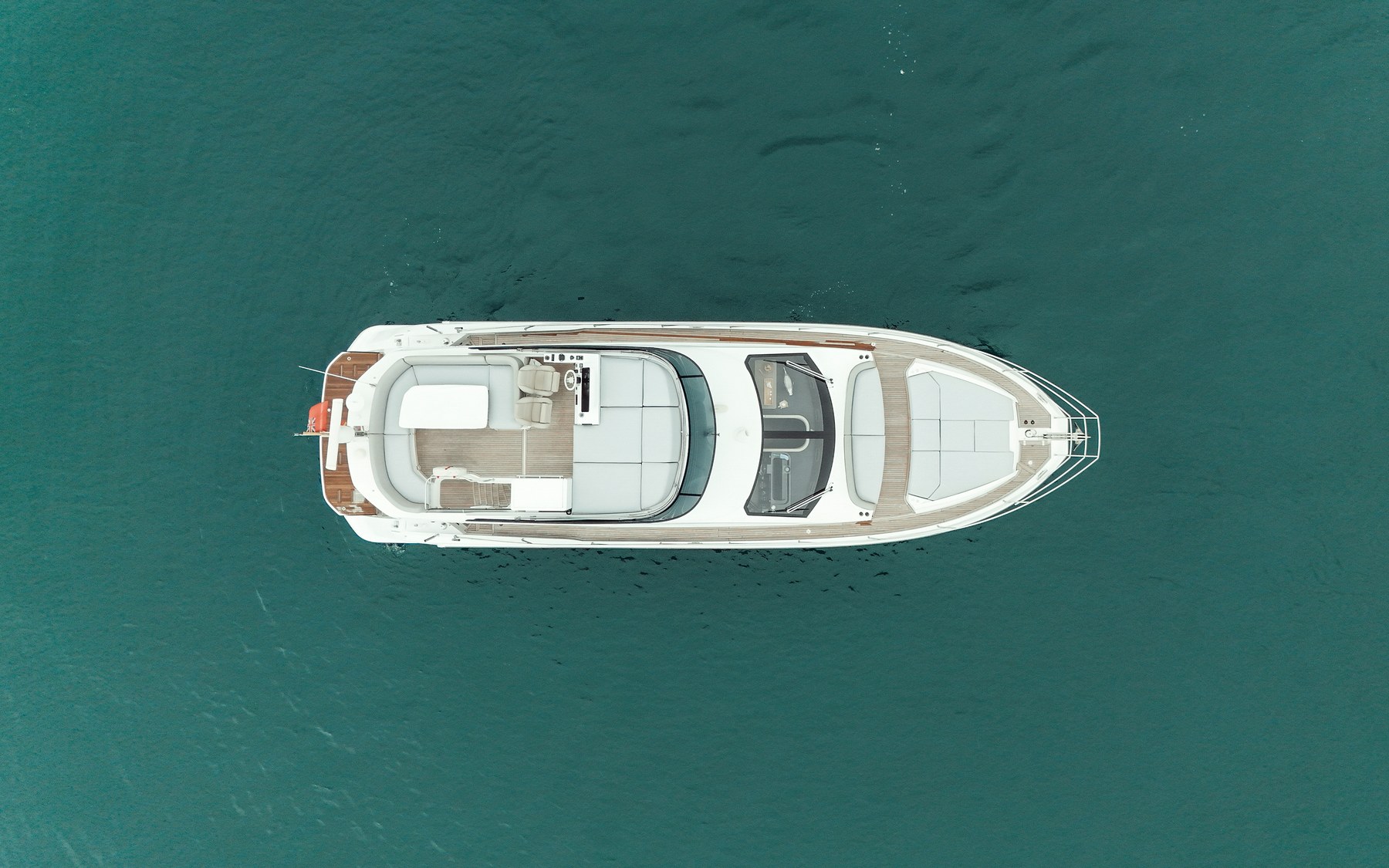 Azimut 53 Sea Shell yacht charter in Mallorca — anchored in a turquoise cove near Puerto Portals, from Marina Palma, La Lonja.