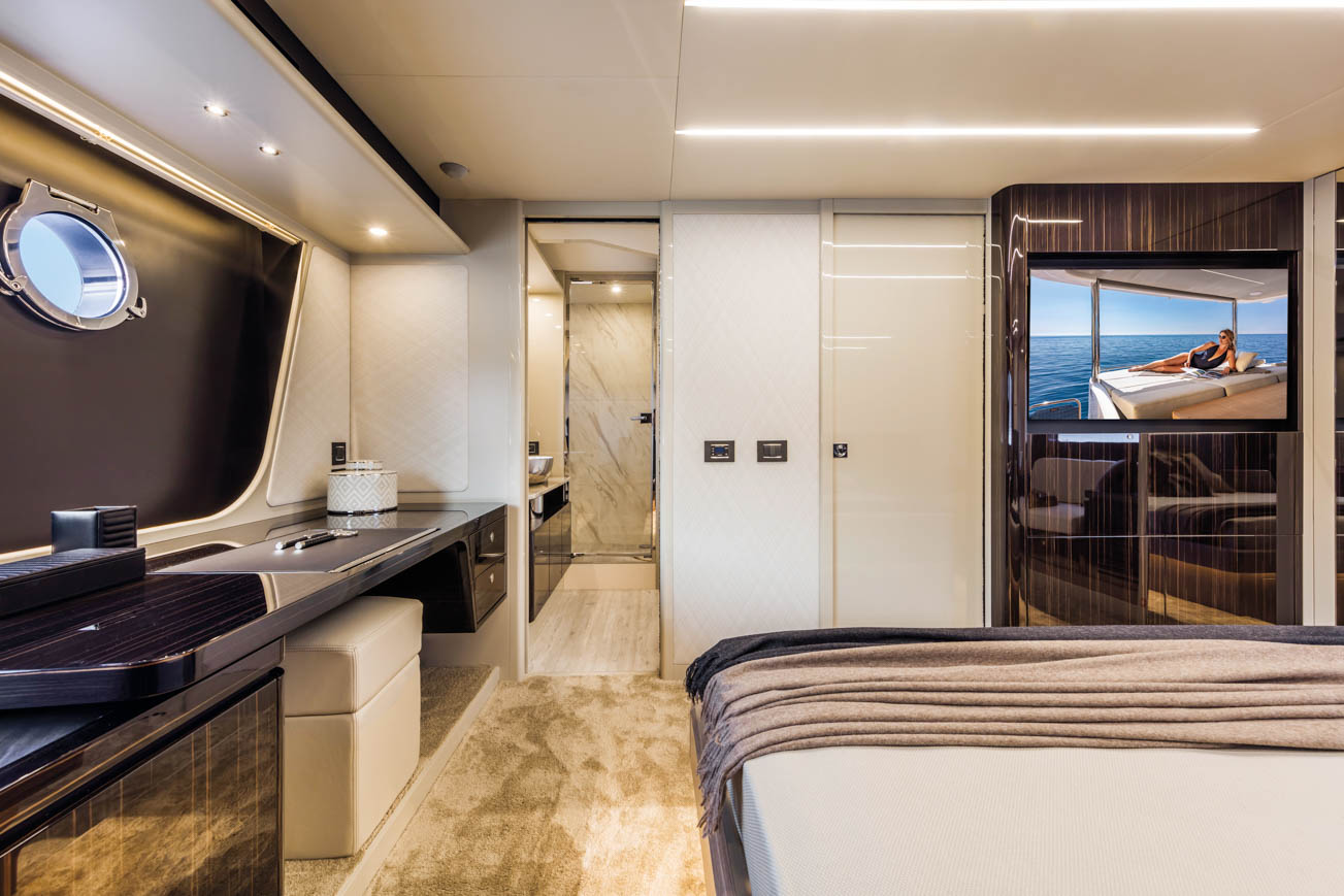 Absolute 62 Fly Emilia II yacht charter in Mallorca — anchored in a turquoise cove near Puerto Portals, from Marina Port de Mallorca, Palma.