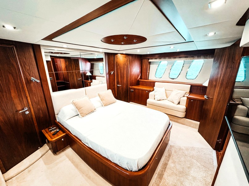 Sunseeker Manhattan 66 Tapia Bay yacht charter in Mallorca — anchored in a turquoise cove near Puerto Portals, from Marina Port, Palma de Mallorca.