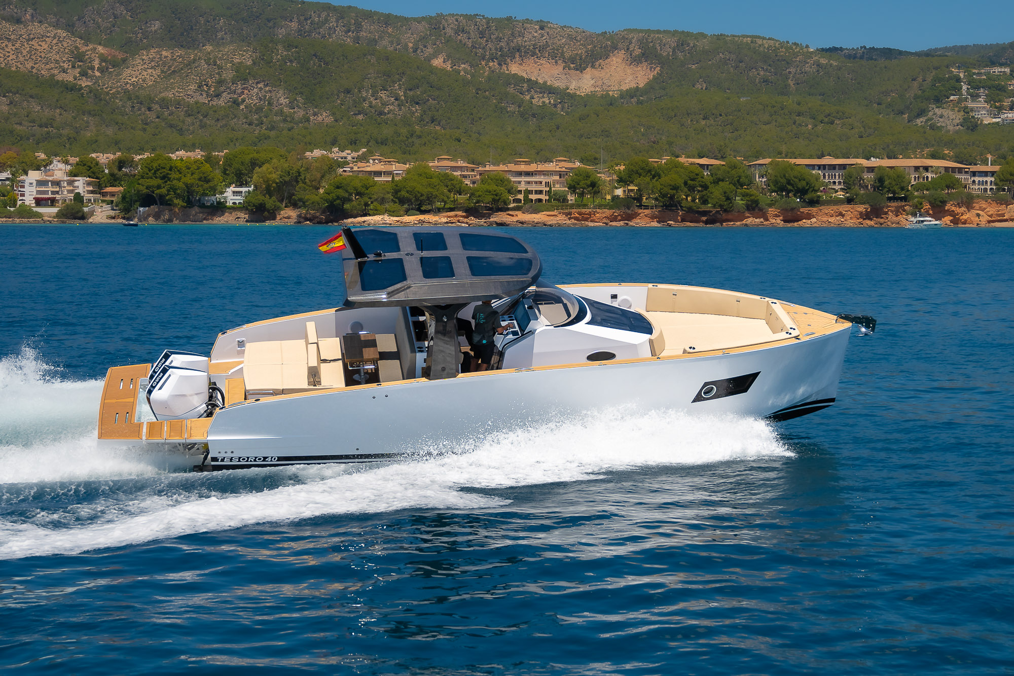 Tesoro T40 GTS New 2026 yacht charter in Mallorca — cruising the south-west coast of Mallorca on a sunlit afternoon, from Puerto Portals.