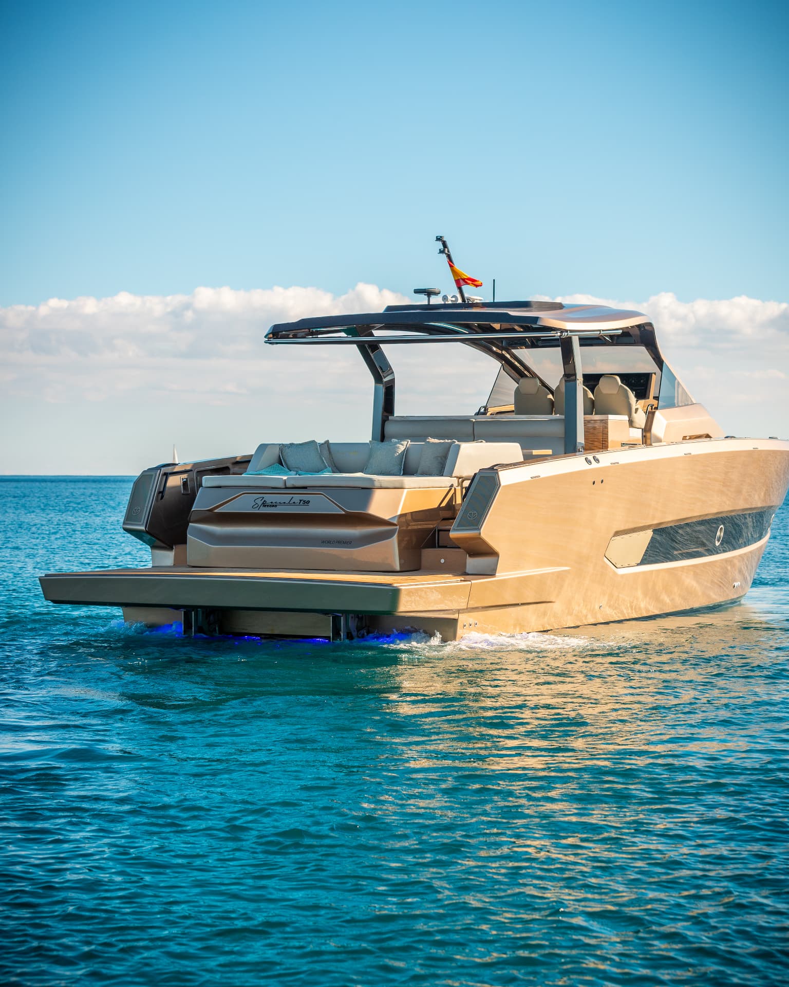 Tesoro T50 Speciale Goldfinger · Armani/Casa yacht charter in Mallorca — bow sunpads with views over the Balearic sea, from Club de Mar, Palma.
