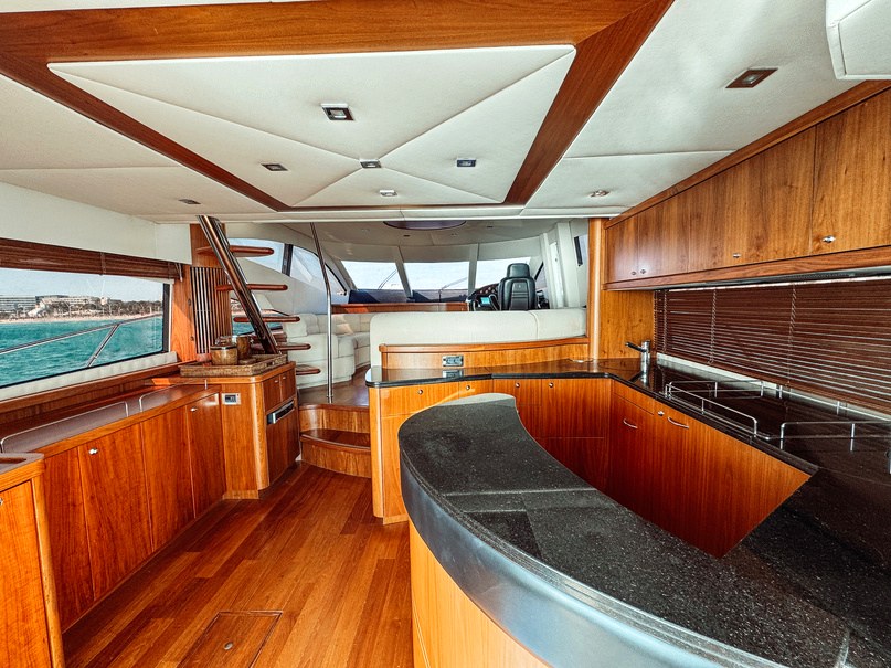 Sunseeker Manhattan 66 Tapia Bay yacht charter in Mallorca — cruising the south-west coast of Mallorca on a sunlit afternoon, from Marina Port, Palma de Mallorca.
