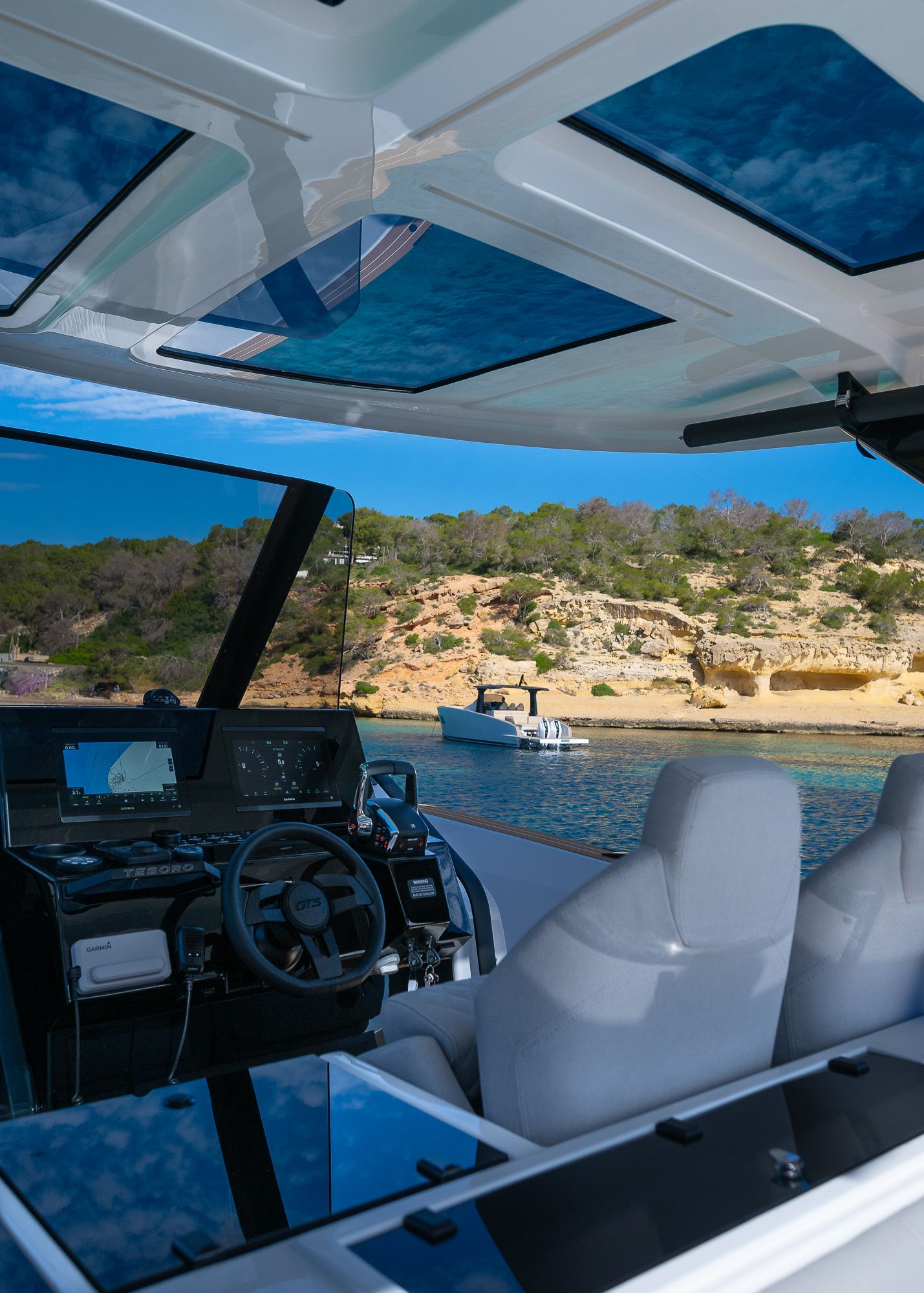 Tesoro T40 GTS New 2026 yacht charter in Mallorca — cockpit lounge shaded for long Mediterranean lunches, from Puerto Portals.